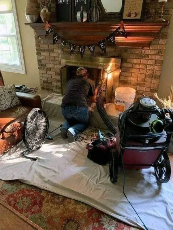 Professional chimney cleaning service with rotary brush in Greenville SC